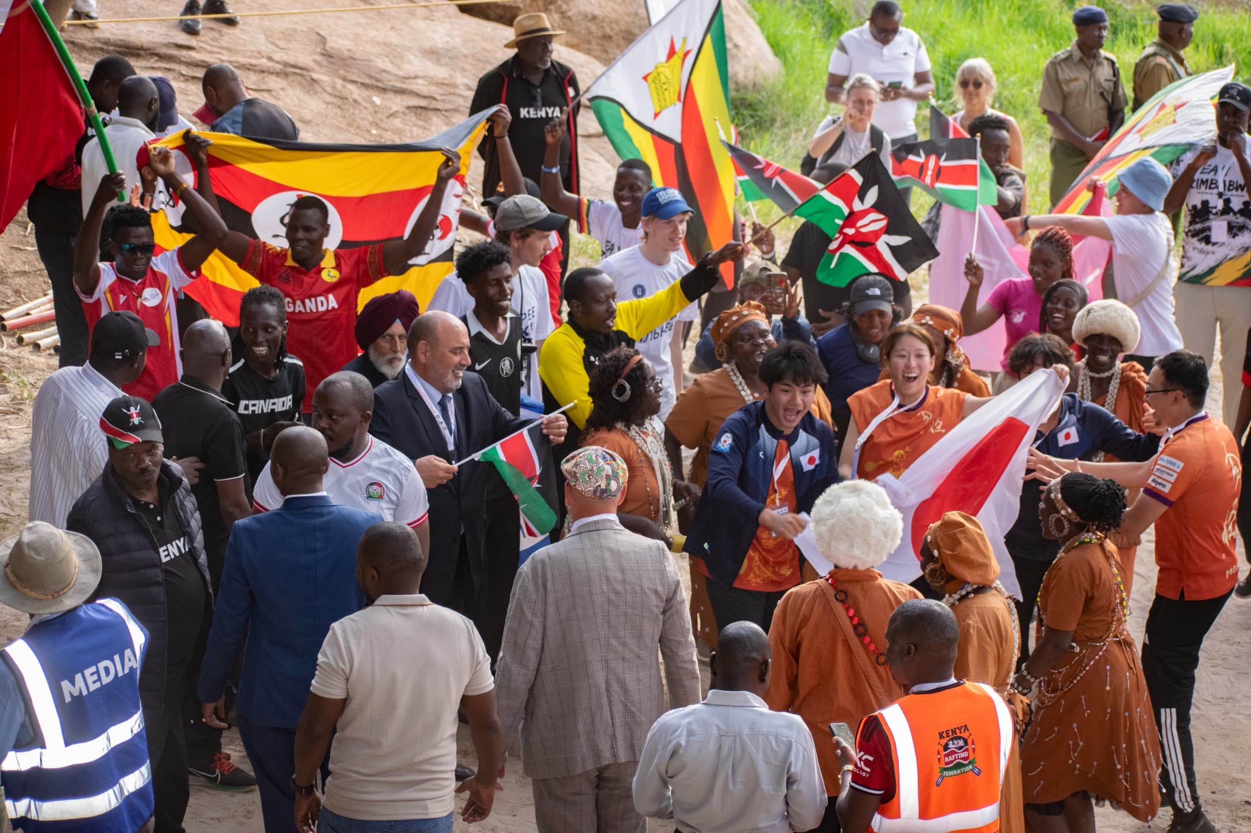 Crowd of supporters with national flags at a rafting competition